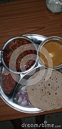 Indian home table food with chapter, oyster mushroom Cary, tomato mix Charlene and onion Stock Photo