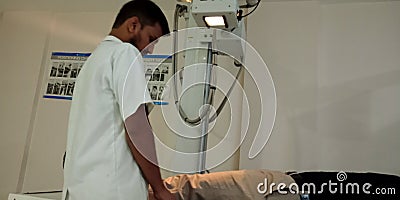 an indian lab technician operating X-ray machine to the patient leg at hospital in india oct 2019 Editorial Stock Photo