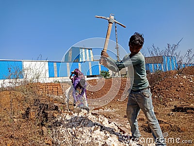 indian labour digging lime soil for construction work in India dec 2019 Editorial Stock Photo