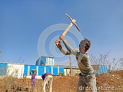 indian labour digging lime soil for construction work in India dec 2019 Editorial Stock Photo