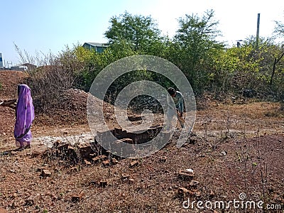 indian labour digging lime soil for construction work in India dec 2019 Editorial Stock Photo