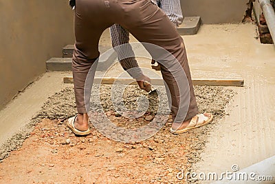 Indian labour plastering using trowel Stock Photo