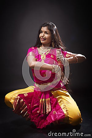 Indian lady performing traditional dance called Bharatnatyam Stock Photo