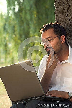 Indian and laptop Stock Photo
