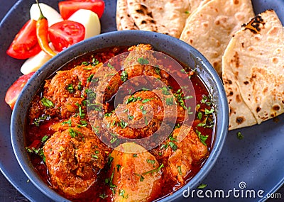 Chicken Curry meal with roti and salad Stock Photo