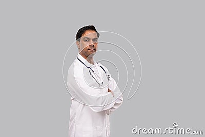 Indian Man Doctor Seroius Face Hands Crossed Isolated. Healthy life, Medicine Concept. Stock Photo