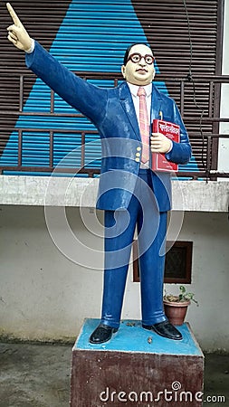 Indian man made beautiful statue of doctor Bhimrao ambedkar with holding & x27;Indian constitution& x27; in hand. Kushinagar city Editorial Stock Photo