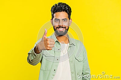 Indian man raises thumbs up agrees or gives positive reply recommends advertisement likes good idea Stock Photo