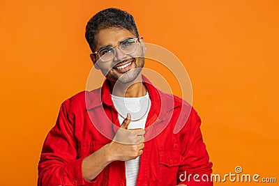 Indian man raises thumbs up agrees or gives positive reply recommends advertisement likes good idea Stock Photo