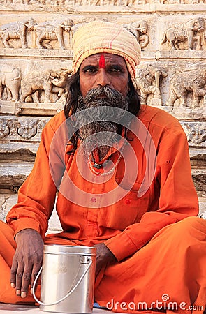 Indian man sitting at Jagdish temple, Udaipur, India Editorial Stock Photo