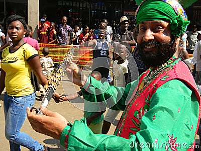 Indian man in traditional custume playing musical instrument. Editorial Stock Photo