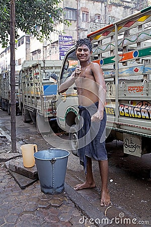 Indian man is washing himself, Kolkata, India Editorial Stock Photo