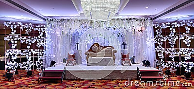 Indian marriage reception stage decoration Stock Photo