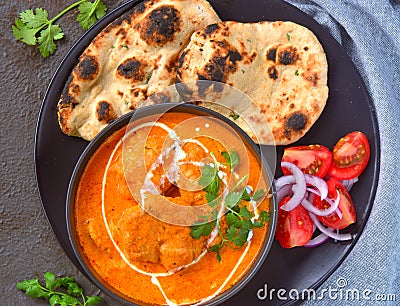 Indian Meal -Butter Chicken with roti and salad Stock Photo