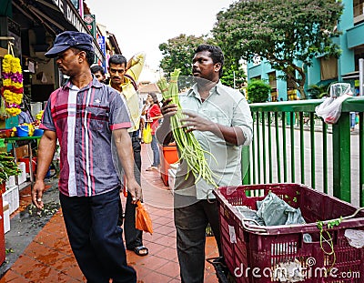 Indian men selling fruits in Chinatown, Singapore Editorial Stock Photo