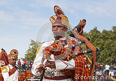 Indian military bagpipers band playing bagpipe during Camel festival in Rajasthan state, India Editorial Stock Photo