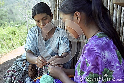 Indian mother and daughter sitting crocheting Editorial Stock Photo