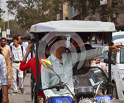 Indian Motor rickshaws and their passengers Editorial Stock Photo