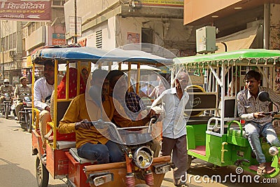 Indian Motor rickshaws and their passengers Editorial Stock Photo