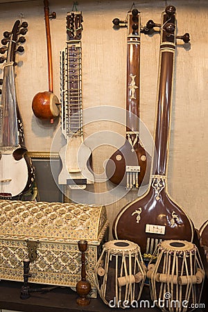 Indian musical instruments stringed guitars called sitars and Indian Folk percussion barrel shaped bass drums Stock Photo