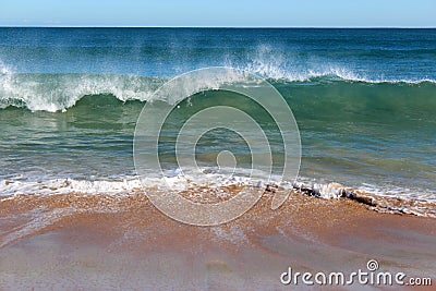 Indian Ocean waves rolling in at pristine Binningup Beach Western Australia on a sunny morning in late autumn. Stock Photo