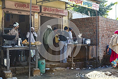 Indian people eating street food in Jaipur, Rajasthan, India Editorial Stock Photo
