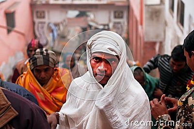 Indian pilgrims dressed in white rises to ancient Temple Editorial Stock Photo