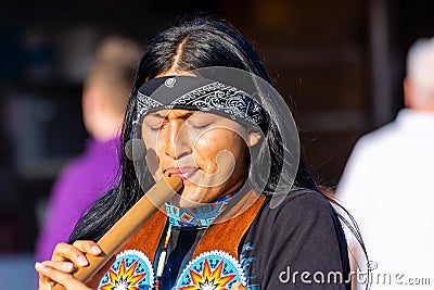 Indian plays the music on the street Karwia, Poland Editorial Stock Photo