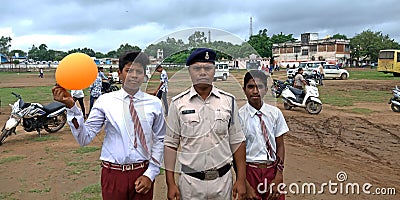 Indian police man standing with school boys during an Independence Day program Editorial Stock Photo