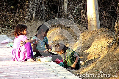 Indian poor girls playing in the street Editorial Stock Photo