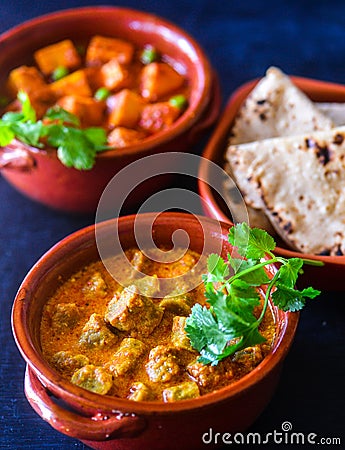 Indian Rajasthani meal-Gatte ki kadhi, roti and aloo matar potato peas curry Stock Photo