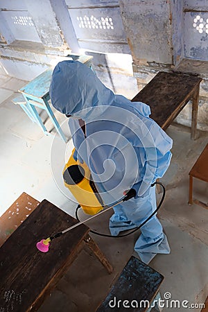 Indian sanitary worker conducting disinfection of the interior during the COVID-19 pandemic Editorial Stock Photo