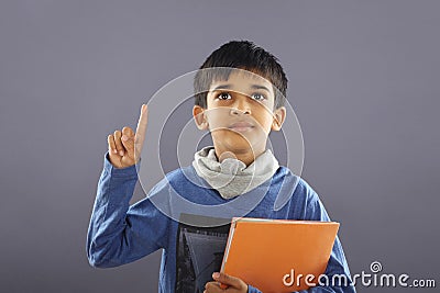 Indian School Boy with Textbook Stock Photo