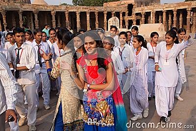 Indian school students standing in the courtyard of Quwwat-Ul-Islam mosque, Qutub Minar, Delhi, India Editorial Stock Photo