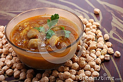 Indian spicy chana masala with raw chickpeas Stock Photo