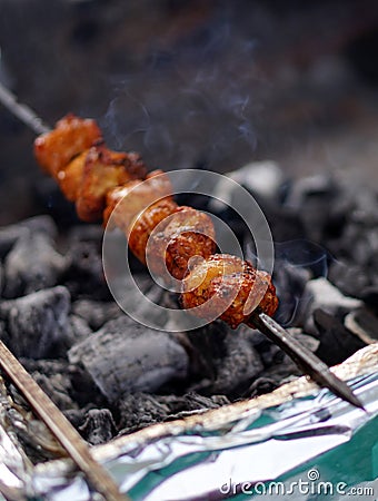 Indian street food vendor making mutton or non vegetarian kababs Stock Photo