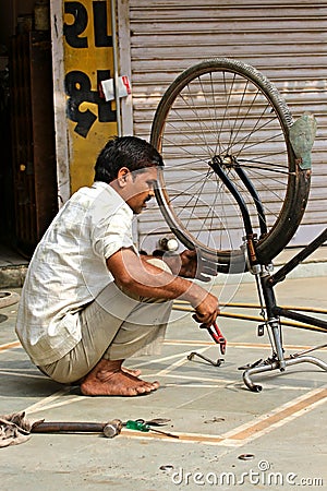 Indian street repair bicycles in Ahmedabad. Photographing October 25, 2015 in Ahmedabad India Editorial Stock Photo