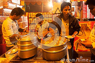 Indian street vendor make fast food in evening Editorial Stock Photo