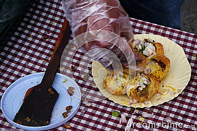 Indian street vendor making pani puri snack in outdoors Stock Photo