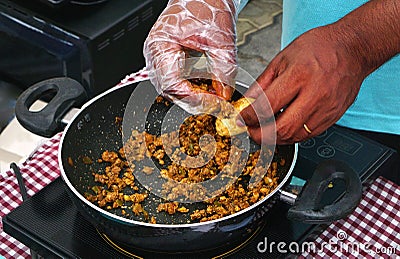 Indian street vendor making pani puri snack in outdoors Stock Photo