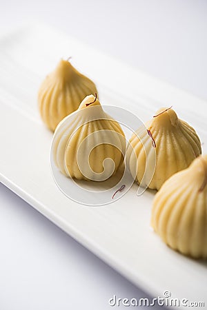 Indian sweet food called modak prepared specifically in ganesh festival or ganesh chaturthi Stock Photo