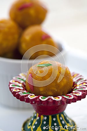 Indian sweet laddu in a colorful red dish Stock Photo