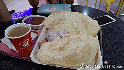Indian tasty chole bhatore with green cold drinks Editorial Stock Photo