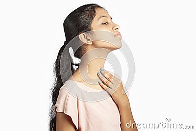 indian girl having soreness in the neck due to thyroid Stock Photo
