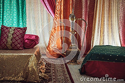 Indian traditional engagement interior traditional setup with colorful blankets and sofas. Stock Photo