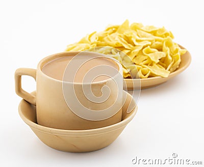 Indian Traditional Masala Chai or Masala Tea Served With Besan Papri on White Background Stock Photo