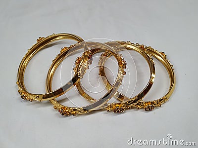 Indian Traditional Women Wear Gold Bangles or Bracelets on white background Stock Photo