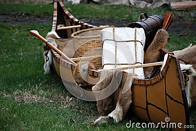 Indian canoe with furs and basket Stock Photo