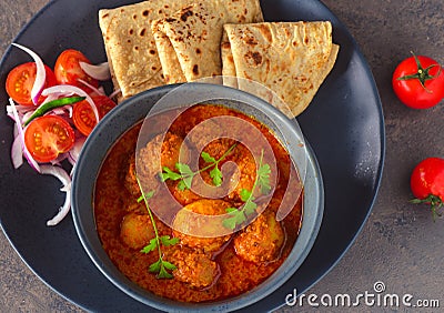 Indian Kashmiri dum aloo or potato curry and roti meal Stock Photo