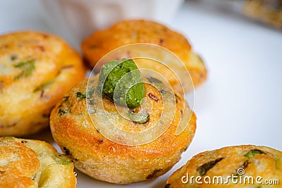 Indian vegan yellow lentil ball filled with fresh veggies and green chutney, appe in hindi Stock Photo